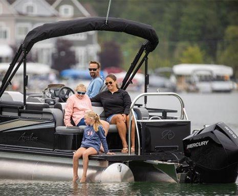Avalon at dock pontoon boat merc engine