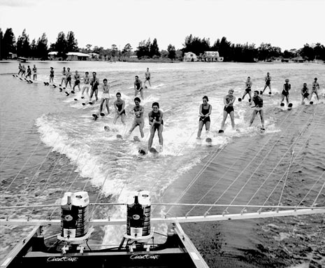 water skiers behind mercury powered boat