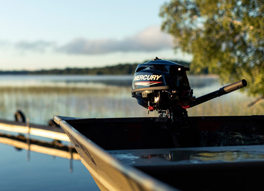 Mercury tiller outboard motor on boat