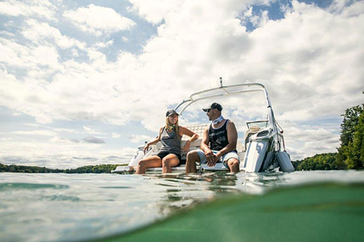 Couple on boat - feet in water